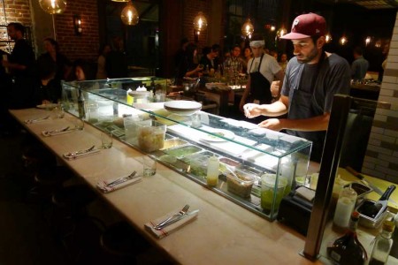 Chef Ori Menashe assembling a dish at Bestia restaurant in downtown Los Angeles