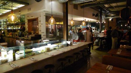Bar-top seating with front row view of the chefs’ workstation at Bestia