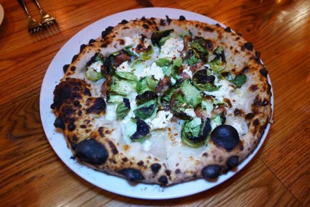 The guanciale pizza at Bestia has house-made Italian bacon, ricotta and Brussels sprouts
