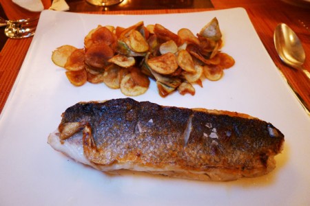 Mediterranean sea bass with potatoes, artichokes, lemon and pantelleria caper jus served at Sirio Ristorante